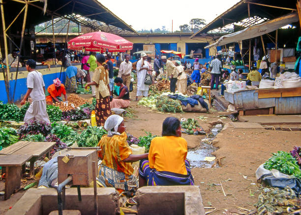 An unidentified vendors in the market on July 24, 2004 in Kampala, Uganda, Africa. Vendors try to sell fruits and vegetables to passers-by. Uganda is one of the poorest nations in the world.